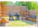 Outdoor grilling area with built-in grill, wood storage, and mature landscaping at 15207 Taralane Ave, Brooksville, FL 34604