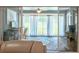 A patio is viewed through sliding glass doors from the interior, creating a seamless transition to the outdoors at 15207 Taralane Ave, Brooksville, FL 34604