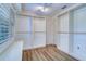 A walk-in closet features custom shelving and lots of space for organization and storage at 1670 Fox Rd, Clearwater, FL 33764
