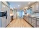 Modern kitchen equipped with stainless steel appliances, countertops, and custom cabinetry at 1670 Fox Rd, Clearwater, FL 33764