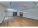 Spacious living room with wood floors, recessed lights and sliding glass doors at 1670 Fox Rd, Clearwater, FL 33764