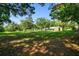 Expansive backyard with mature trees provides ample space for outdoor activities and relaxation at 17801 Simmons Rd, Lutz, FL 33548