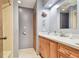 Bathroom featuring a wood vanity, sink, and a neutral color scheme at 17801 Simmons Rd, Lutz, FL 33548