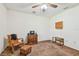 Cozy bedroom with a vintage rocking chair and ottoman set at 17801 Simmons Rd, Lutz, FL 33548