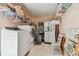 Laundry room with washer, dryer, refrigerator and storage at 17801 Simmons Rd, Lutz, FL 33548