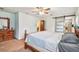 Comfortable main bedroom featuring neutral walls, carpet, and ensuite bathroom entrance at 17801 Simmons Rd, Lutz, FL 33548