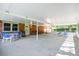 Spacious covered patio with comfortable seating, ideal for outdoor entertaining and relaxation at 17801 Simmons Rd, Lutz, FL 33548