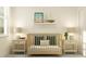Comfortable Bedroom with neutral tones featuring a crib with soft blue pillows and a sailboat decoration at 18477 Serene Lake Loop, Lutz, FL 33548