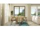 Bright dining area features a stylish table with seating for six, and a sliding glass door for easy outdoor access at 18477 Serene Lake Loop, Lutz, FL 33548