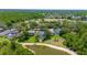Aerial view of homes backing to a golf course and a tranquil lake at 19412 Heritage Harbor, Lutz, FL 33558