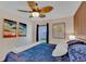 Cozy bedroom featuring a ceiling fan, and natural light from the windows at 19412 Heritage Harbor, Lutz, FL 33558