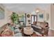 Comfortable living room with plush seating and natural light from arched windows at 19412 Heritage Harbor, Lutz, FL 33558