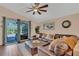 Spacious living room with sliding glass doors that leads to the outdoor lanai and pool area at 19412 Heritage Harbor, Lutz, FL 33558