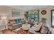 Spacious living room featuring stylish furniture and arched windows with natural light at 19412 Heritage Harbor, Lutz, FL 33558