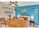 Cozy bedroom with decorative wall accents, ceiling fan, and neutral decor, offering a serene retreat at 19412 Heritage Harbor, Lutz, FL 33558