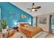 Bedroom featuring stylish decor, fan, and plenty of natural light, creating a welcoming space at 19412 Heritage Harbor, Lutz, FL 33558