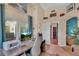 Bright office featuring large desk and patio access, with view of walk-in closet and bedroom at 19412 Heritage Harbor, Lutz, FL 33558