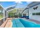 Beautiful pool area with comfortable lounge seating and lush landscaping at 19412 Heritage Harbor, Lutz, FL 33558