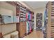Well-organized walk-in closet with custom shelving, drawers, and ample hanging space at 19412 Heritage Harbor, Lutz, FL 33558