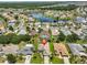 Aerial view of a neighborhood with lake at 2316 Lyndhurst Dr, Sun City Center, FL 33573