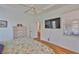Bright bedroom features wood floors and a large window at 2316 Lyndhurst Dr, Sun City Center, FL 33573