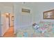 Inviting bedroom featuring coastal-themed bedding, closet, and light-filled atmosphere at 2316 Lyndhurst Dr, Sun City Center, FL 33573