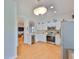 A lovely, bright kitchen features stainless steel appliances, white cabinets, and recessed lighting at 2316 Lyndhurst Dr, Sun City Center, FL 33573
