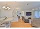 Spacious living room with hardwood floors, lots of light, and views into the dining room at 2316 Lyndhurst Dr, Sun City Center, FL 33573