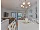 Open-concept living room with hardwood floors, and view into the dining area at 2316 Lyndhurst Dr, Sun City Center, FL 33573