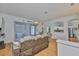 Living area with hardwood floors with sliding doors leading to the patio at 2316 Lyndhurst Dr, Sun City Center, FL 33573