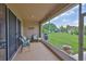 Screened in patio with furniture overlooking the backyard at 2316 Lyndhurst Dr, Sun City Center, FL 33573