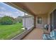 Screened in patio with backyard and home exterior views at 2316 Lyndhurst Dr, Sun City Center, FL 33573