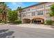 Attractive building exterior with a convenient covered parking entrance and lush landscaping adding to the curb appeal at 2410 W Azeele St # 214, Tampa, FL 33609