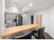 Kitchen featuring gray cabinets, butcher block island, and stainless steel appliances at 2410 W Azeele St # 214, Tampa, FL 33609