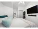 Clean and modern bedroom with a mounted TV, walk-in closet, and ensuite bathroom at 2410 W Azeele St # 214, Tampa, FL 33609