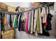 Walk-in closet features an abundance of shelving and hanging storage for clothes at 2410 W Azeele St # 214, Tampa, FL 33609