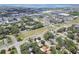 Panoramic aerial view showcasing residential area with proximity to commercial centers, roadways, and waterfront at 2484 Whitman St, Clearwater, FL 33765