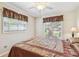 Well-lit bedroom with hardwood floors, and modern ceiling fan at 2484 Whitman St, Clearwater, FL 33765