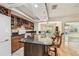 Bright kitchen features granite countertops, wooden cabinets, and stainless steel appliances at 2484 Whitman St, Clearwater, FL 33765