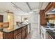 Bright kitchen features a ceiling fan, wooden cabinets, and a window with natural light at 2484 Whitman St, Clearwater, FL 33765