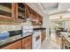 The kitchen showcases tile backsplash, a range, and wooden cabinets at 2484 Whitman St, Clearwater, FL 33765