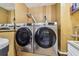 Laundry room features a washer, dryer and utility sink at 2484 Whitman St, Clearwater, FL 33765
