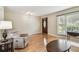 Bright living room features hardwood floors, a decorative front door, and a large window at 2484 Whitman St, Clearwater, FL 33765