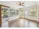 Spacious living room with wood flooring, lots of natural light and backyard access at 2484 Whitman St, Clearwater, FL 33765