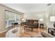 Cozy living room with hardwood floors, large window, and comfortable furnishings at 2484 Whitman St, Clearwater, FL 33765