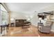 Bright living room with hardwood flooring, neutral colors, and comfortable seating at 2484 Whitman St, Clearwater, FL 33765