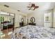 Bright main bedroom with hardwood floors, and mirrored closet doors at 2484 Whitman St, Clearwater, FL 33765