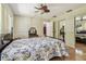 Spacious main bedroom with traditional furnishings, mirrored closet doors and ceiling fan at 2484 Whitman St, Clearwater, FL 33765
