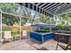 Outdoor screened patio with brick pavers and hot tub under canopy at 2484 Whitman St, Clearwater, FL 33765