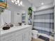 Modern bathroom featuring a spacious vanity, framed mirror, and shower with decorative curtain at 2781 Dolores Home Ave, Valrico, FL 33594